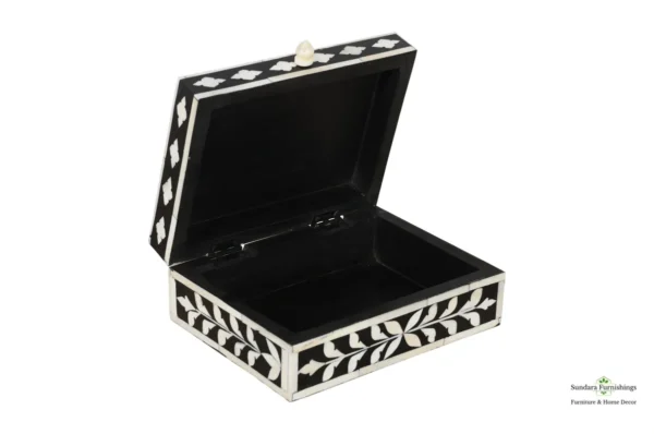 A black and white box with a lid open.