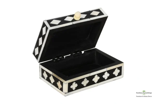 A black and white box with a gold top.