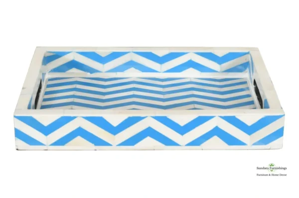 A blue and white striped tray with a chevron pattern.