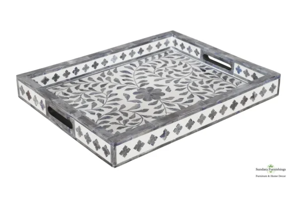 A tray with a pattern of leaves and flowers.