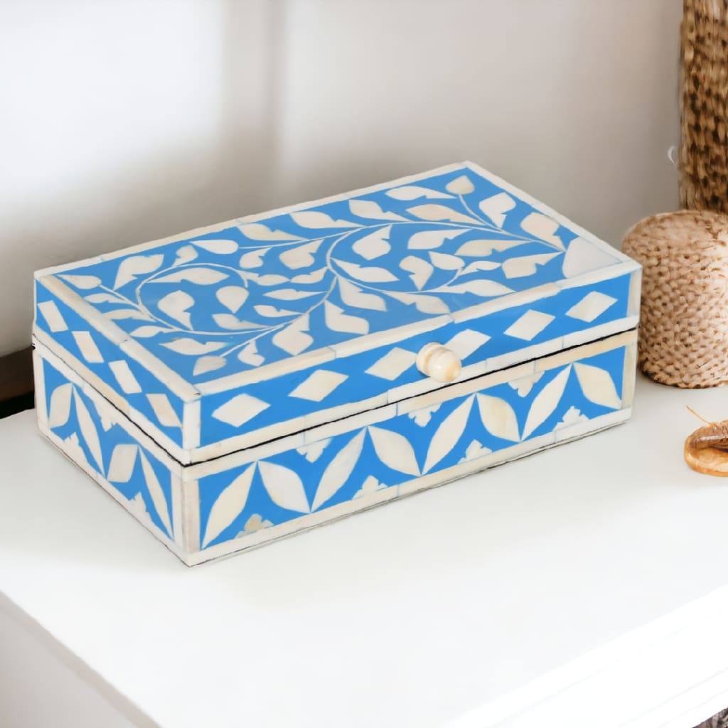 A blue and white box sitting on top of a table.