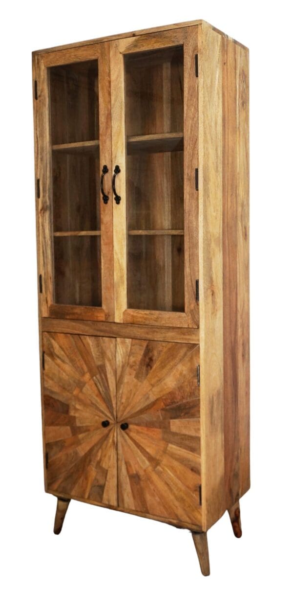 A wooden cabinet with glass doors and a sun design on the front.