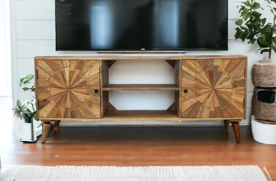 hand-crafted sunburst design tv unit staged in a living room