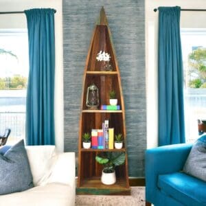 boat bookcase made of reclaimed wood staged in a living room