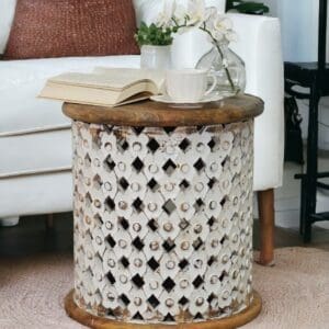 whitewashed wood lattice side table with a natural top staged in a living room