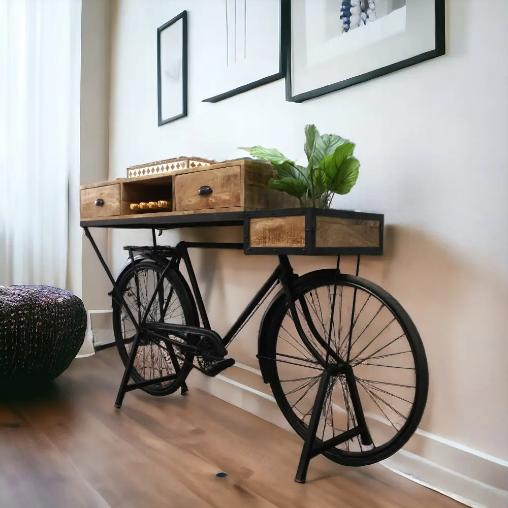 A vintage bicycle converted into t a console table with drawers staged in a home