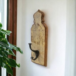 reclaimed wood single coat hook hanging on a wall