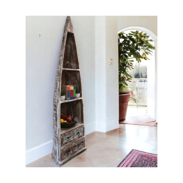 white washed boat bookcase staged in a home