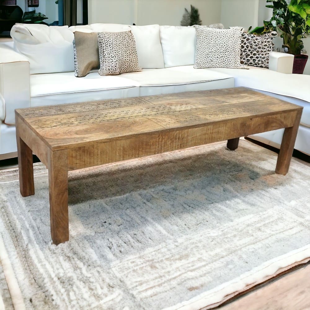 hand-crafted coffee table or wide bench staged in a living room with a white sofa