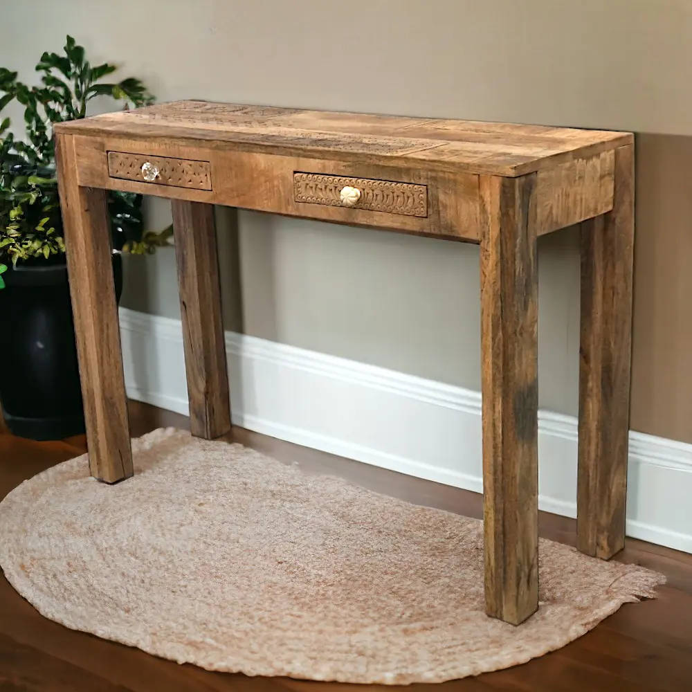 Hand-carved solid wood console table with two drawers staged in a hallway