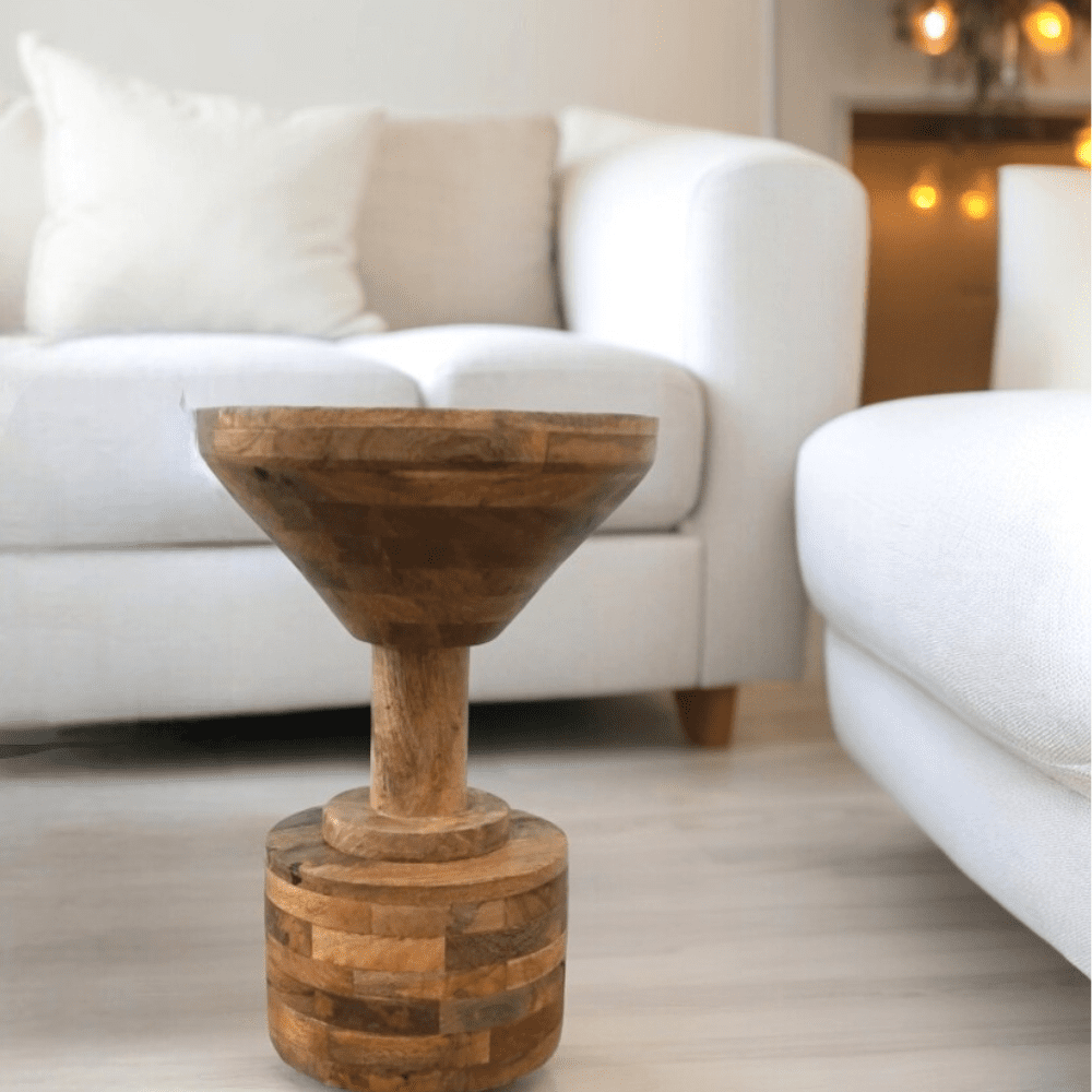 Natural wood unique side table or plant stand staged in a living room