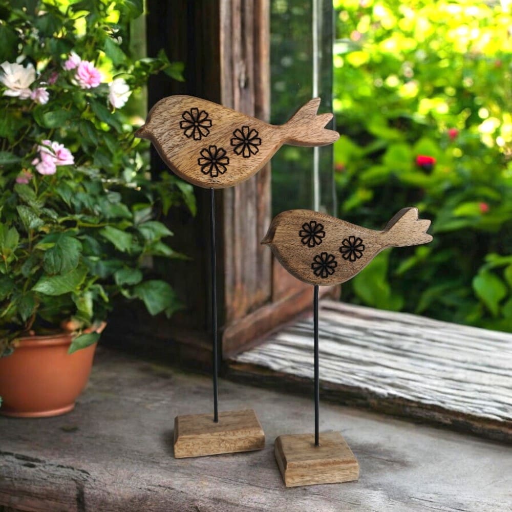 Set of two birds, hand-crafted decor accent staged on a rustic window sill