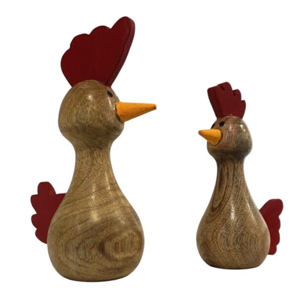 Two hand-crafted wooden chickens