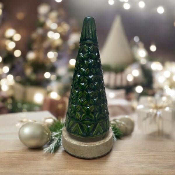 Small wooden carved Christmsa tree staged on a table