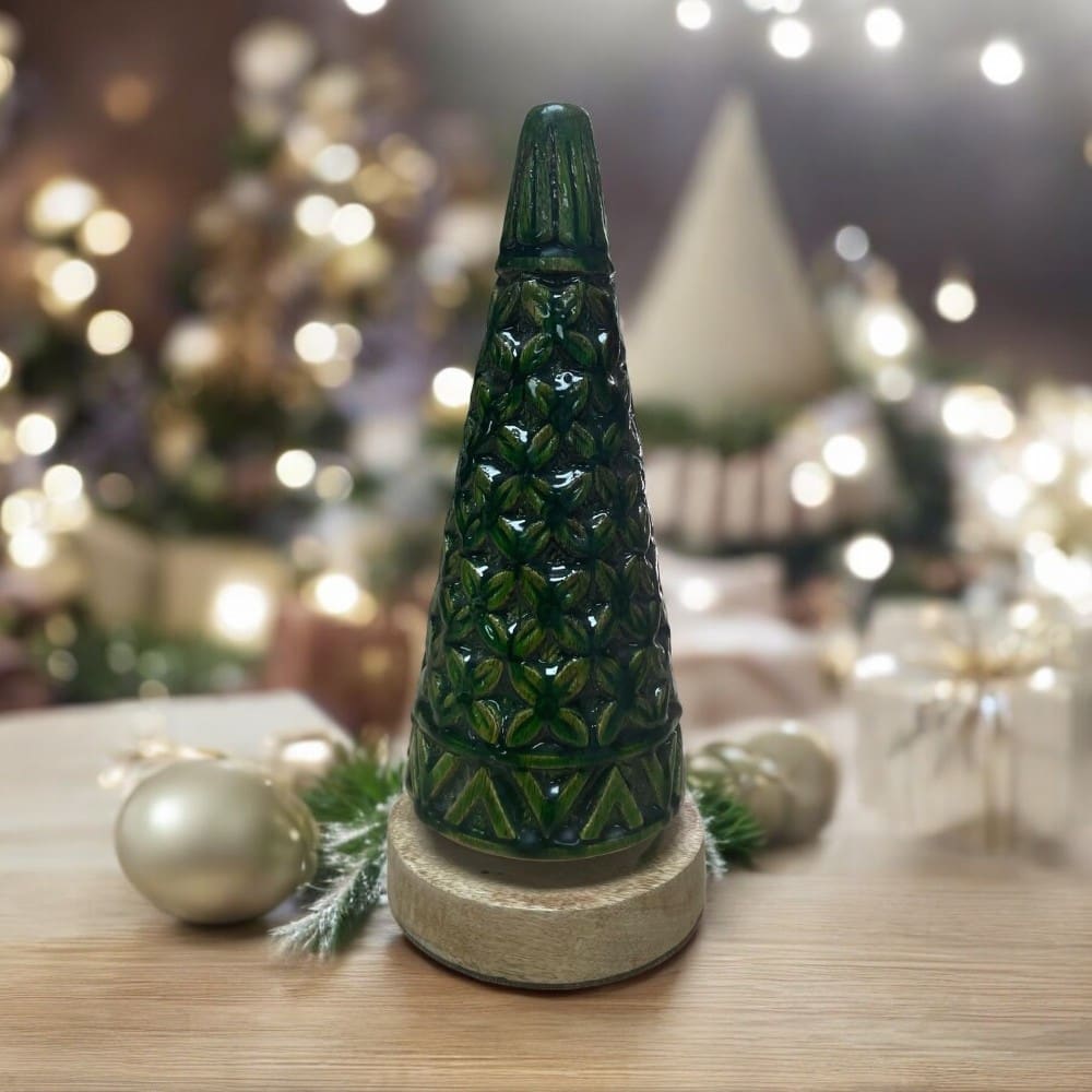 Small wooden carved Christmsa tree staged on a table