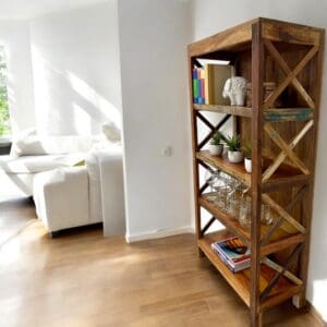 reclaimed wood bookcase staged in a living room