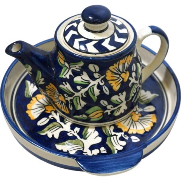 Ceramic teapot with matching round ceramic tray