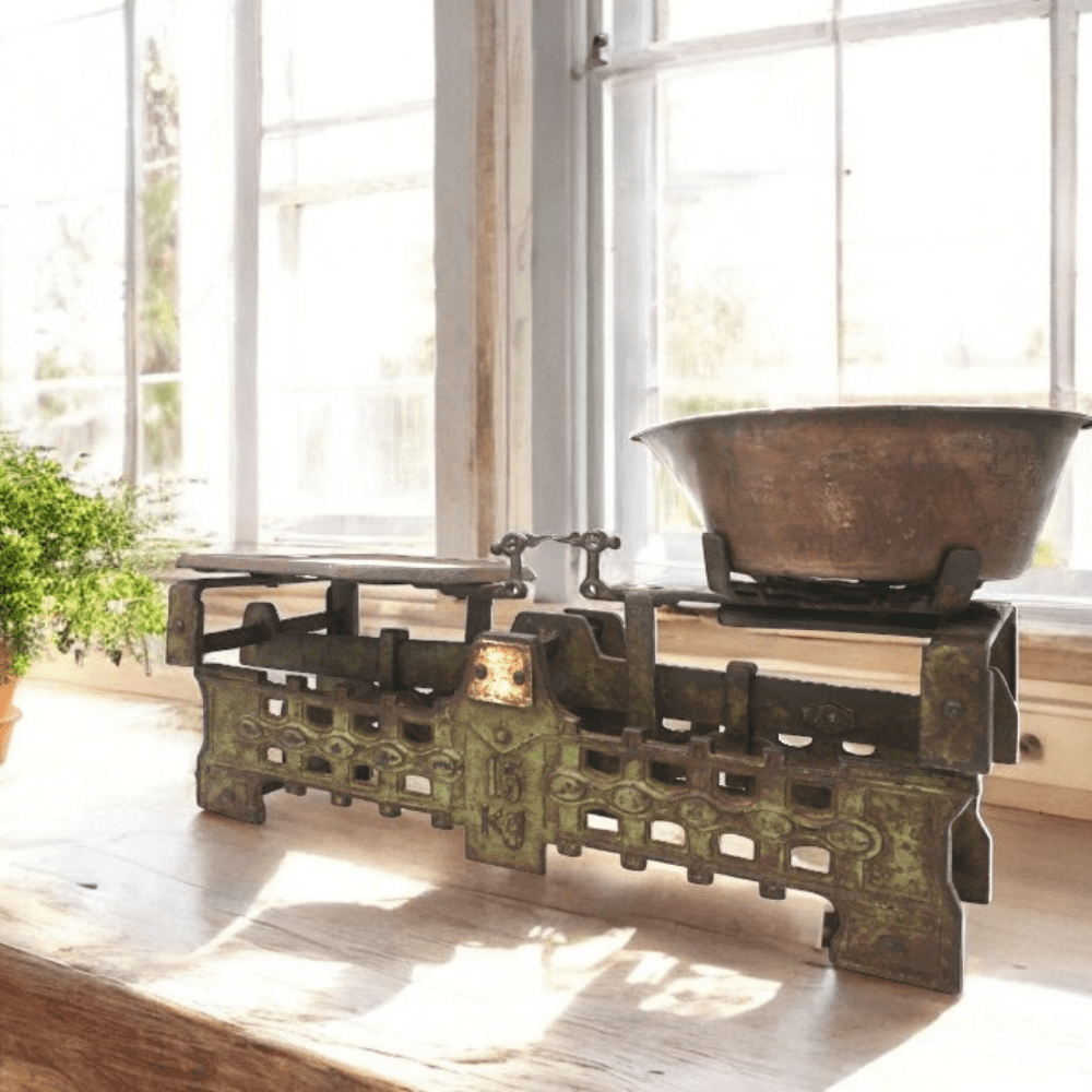 Vintage ornate kitchen cast iron scale set on a sunny kitchen counter