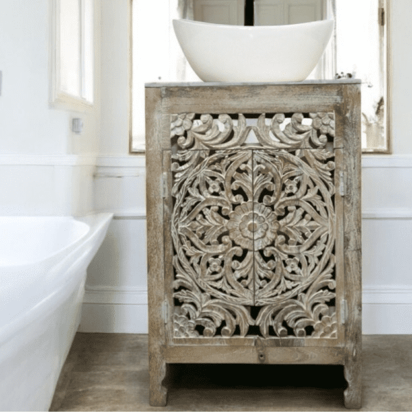 Hand-crafted solid wood 24" inch vanity with hand-carved doors in a bathroom