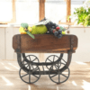 Vintage brick mold wood trolley staged as a small fruit bowl in a sunny kitchen