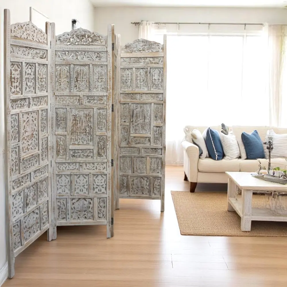 Hand-crafted solid wood screen room divider in a whitewashed finish staged in a sunny living room