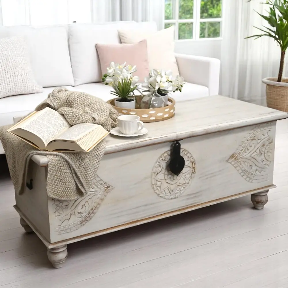 Hand-crafted, white-washed large bench trunk staged in a sunny living room