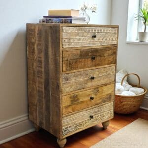 Hand-crafted rustic 5 drawer dresser with unique drawer fronts staged in a home