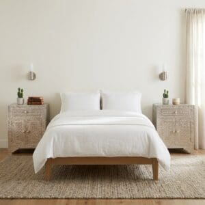 Pair of hand-crafted metal embossed nightstands stage in a sunny bedroom