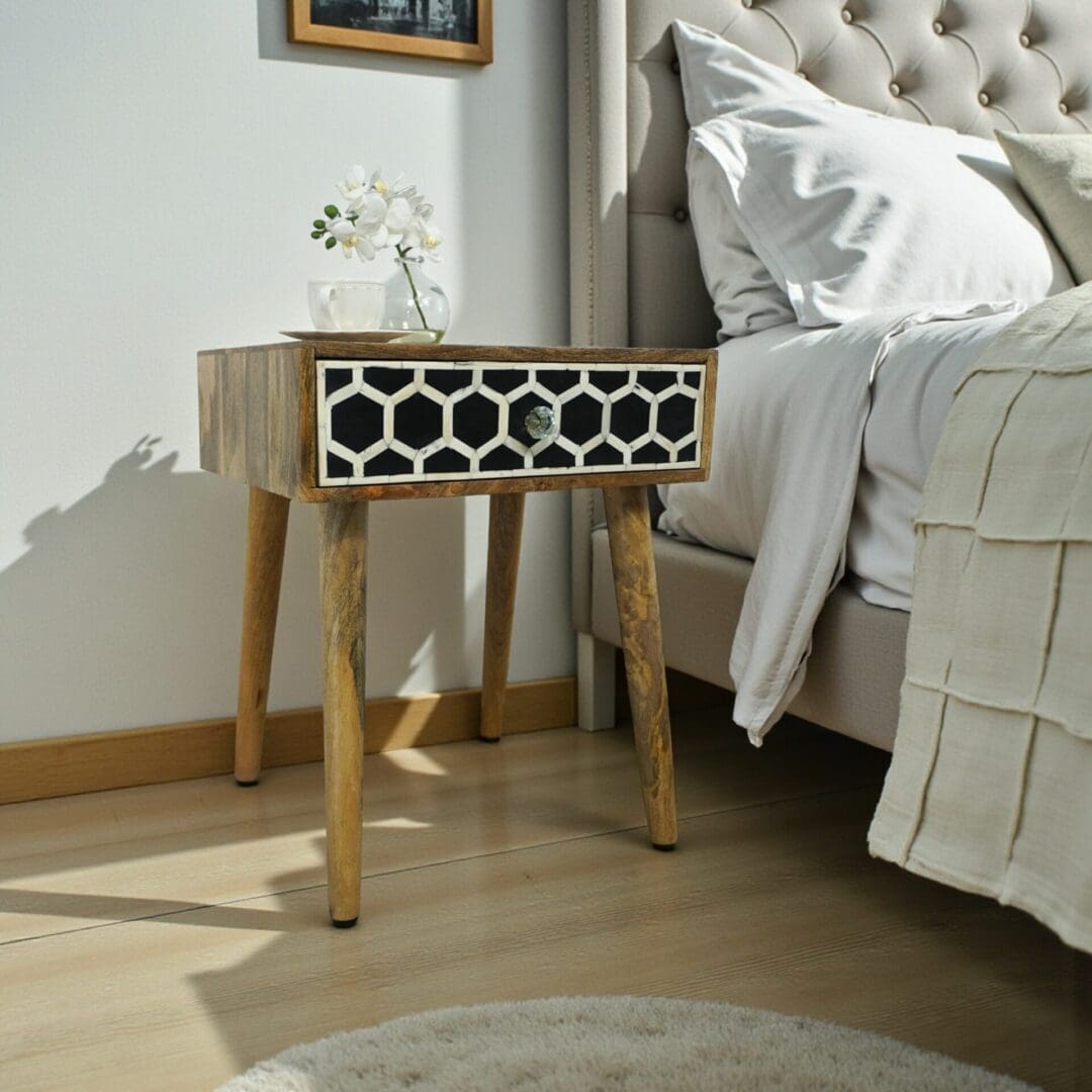 Hand-crafted solid wood modern style nightstand/side table with black and wite geometric pattern bone inlay drawer front.